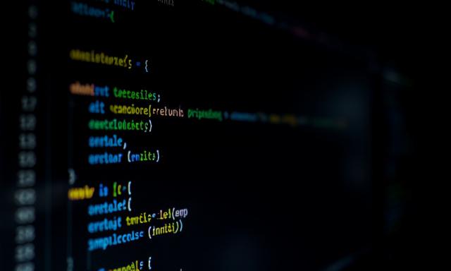 Close-up of code on a computer screen, representing bespoke software development